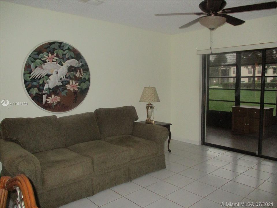 Living area with sliding glass door out to patio
