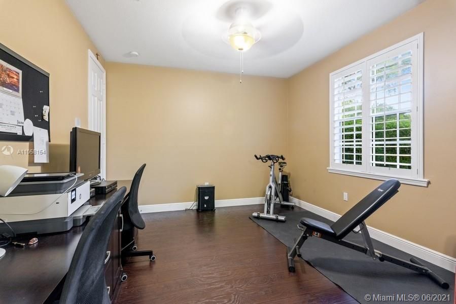 Second bedroom with private bathroom.  Currently used an an in home office and gym.