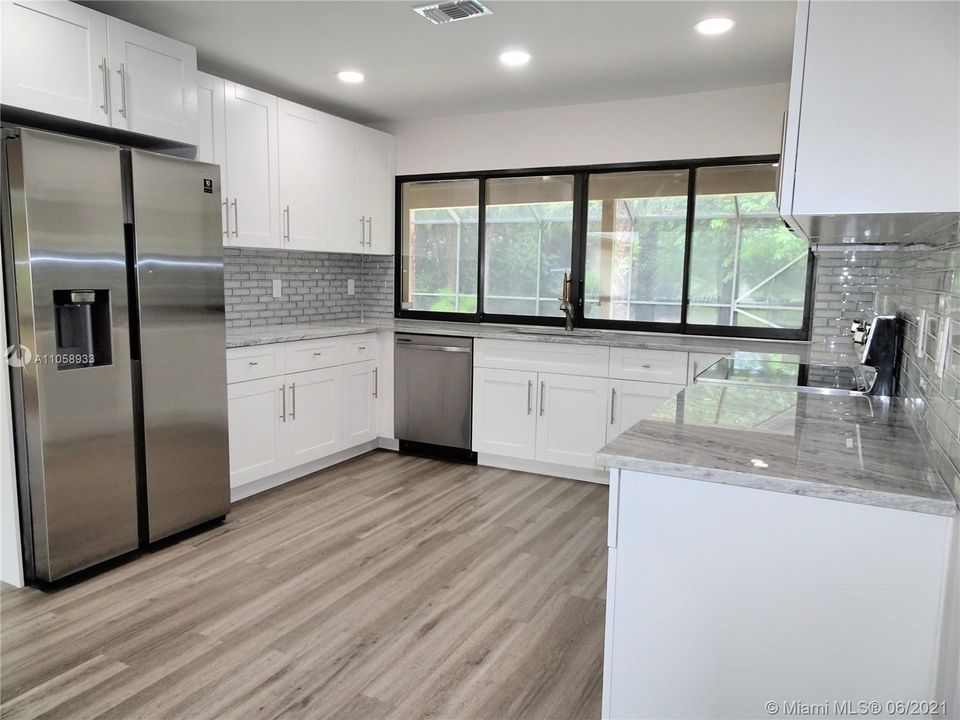 Brand new....everything.  Stainless appliances, White Shaker cabinets, quartz counters, mirrored subway backsplash, new flooring, new roof and soooo much more.