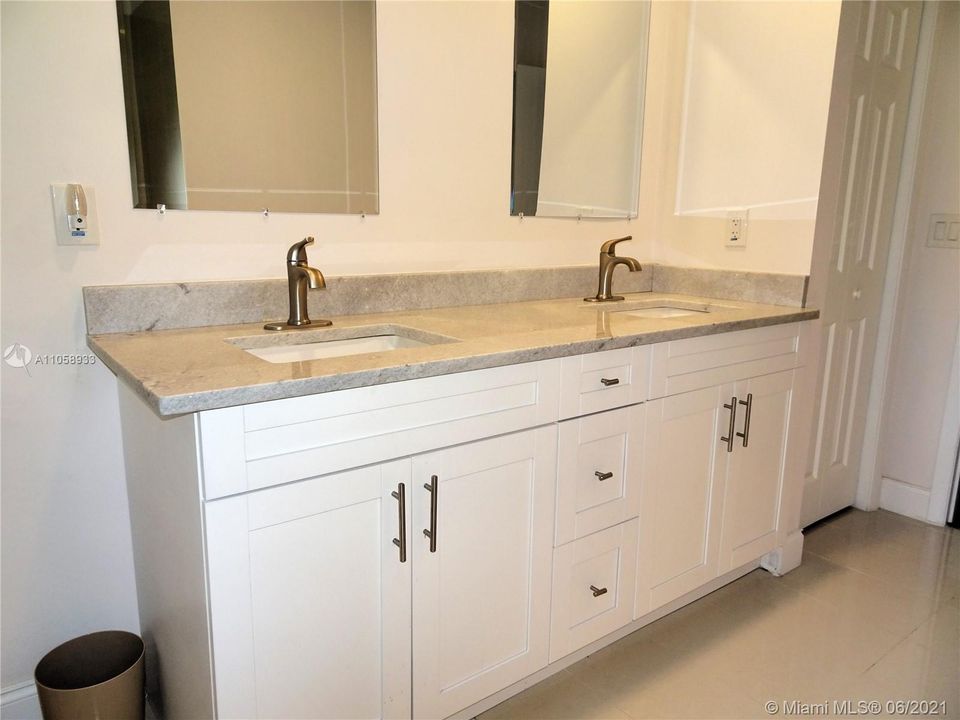 Master bath has granite counters and his and her sinks