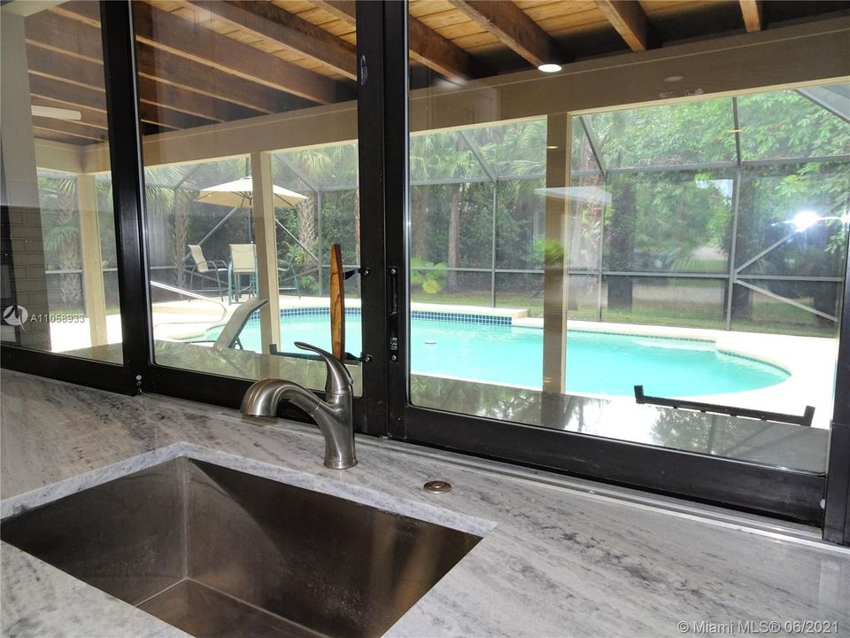 Pass through to the screened pool and patio.