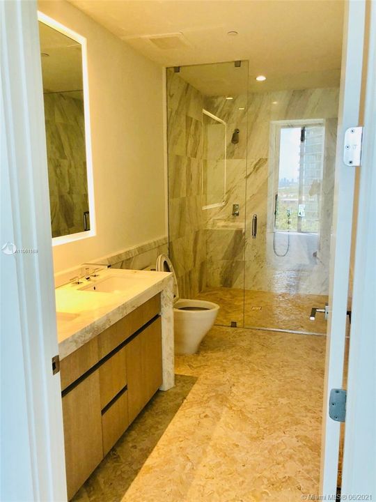 Master bath with double shower and vanities.