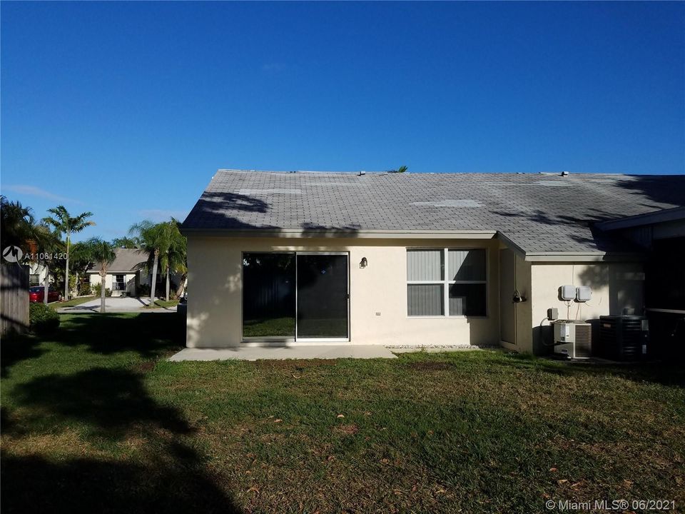 Open patio and small attached shed for additional storage.