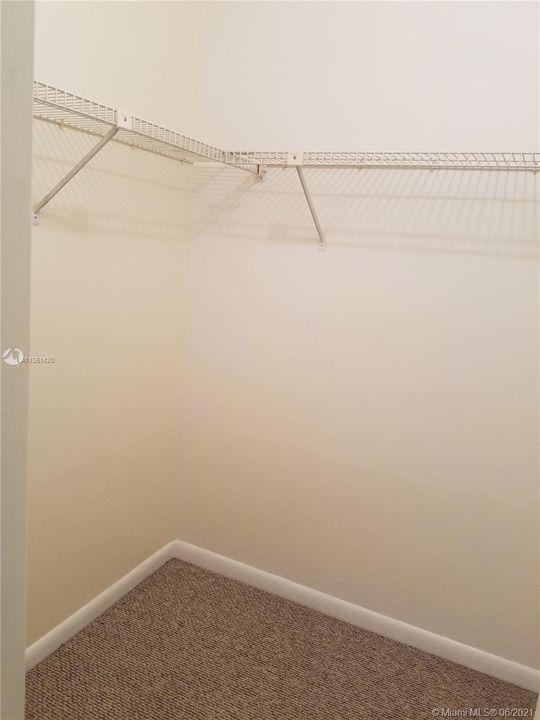 Large walk-in closet in master bedroom.