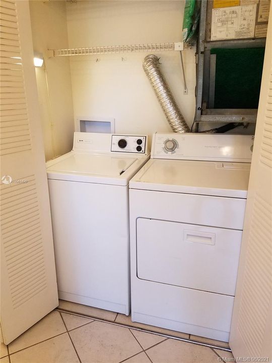 Full size washer and dryer inside the unit.