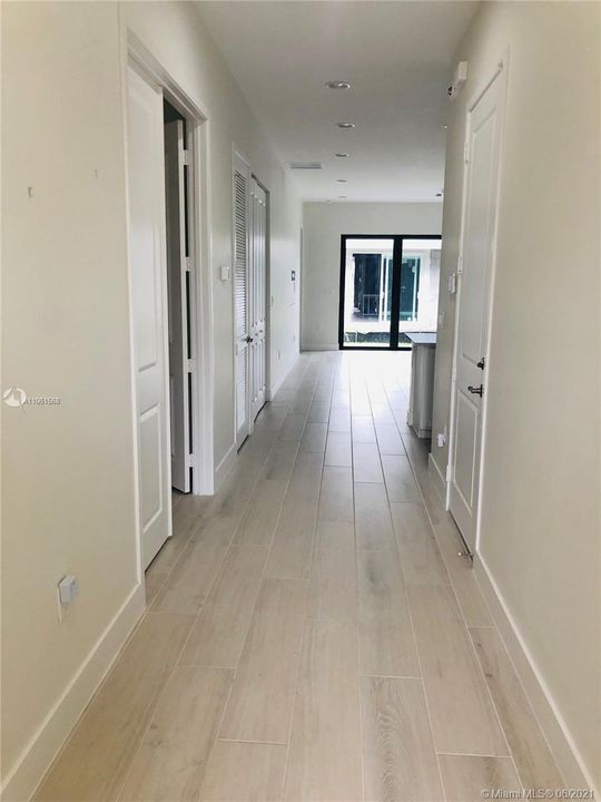 Foyer looking into unit, note the wood look floor tile.