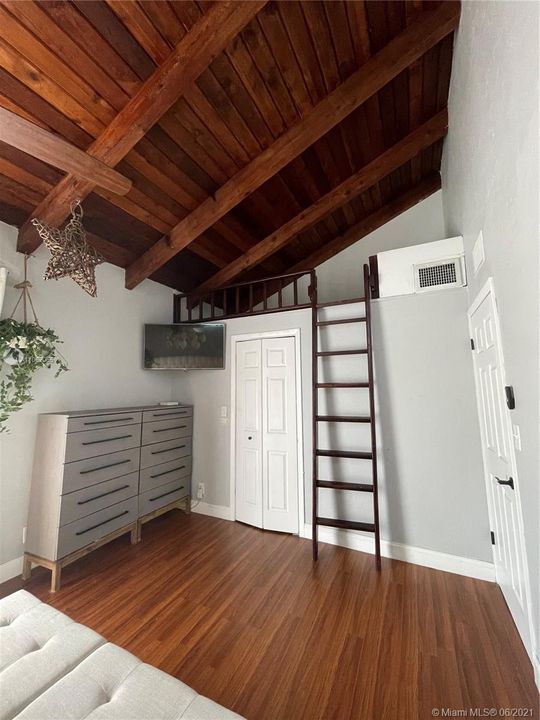 Spacious Master Bedroom with Walk-in Closet and a small loft above it