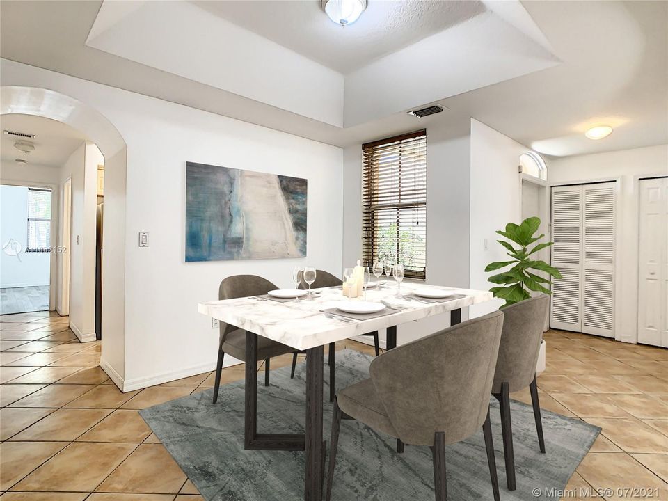 Casual Dining room with tray ceilings. (“Virtual Staging”)