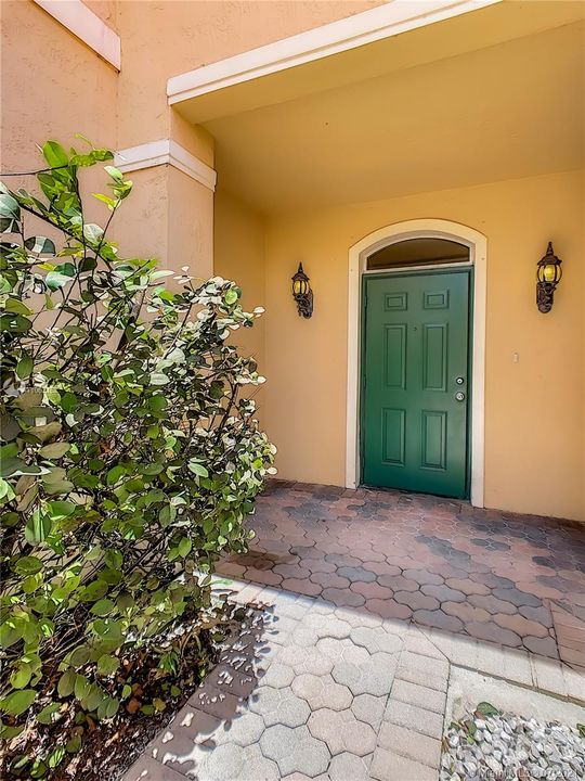 Front door entrance with sconces