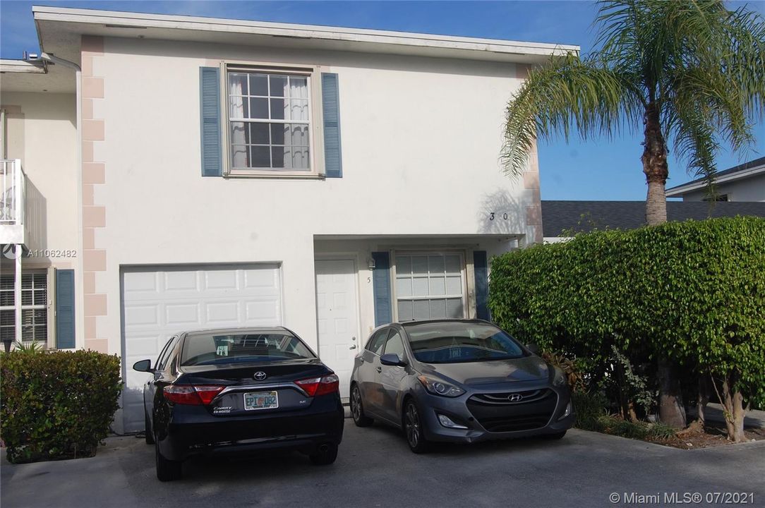 One car garage and two space in front of the townhouse. Additional Visitors Parking in front.