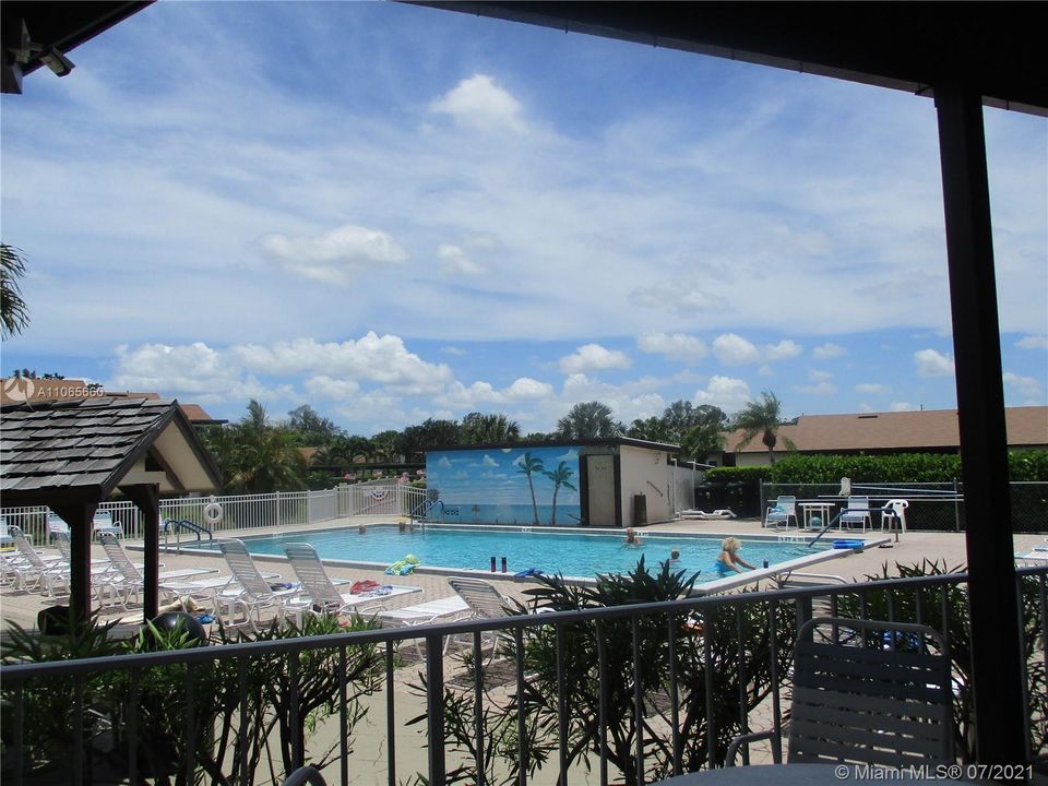 Pool area with mural of ocean