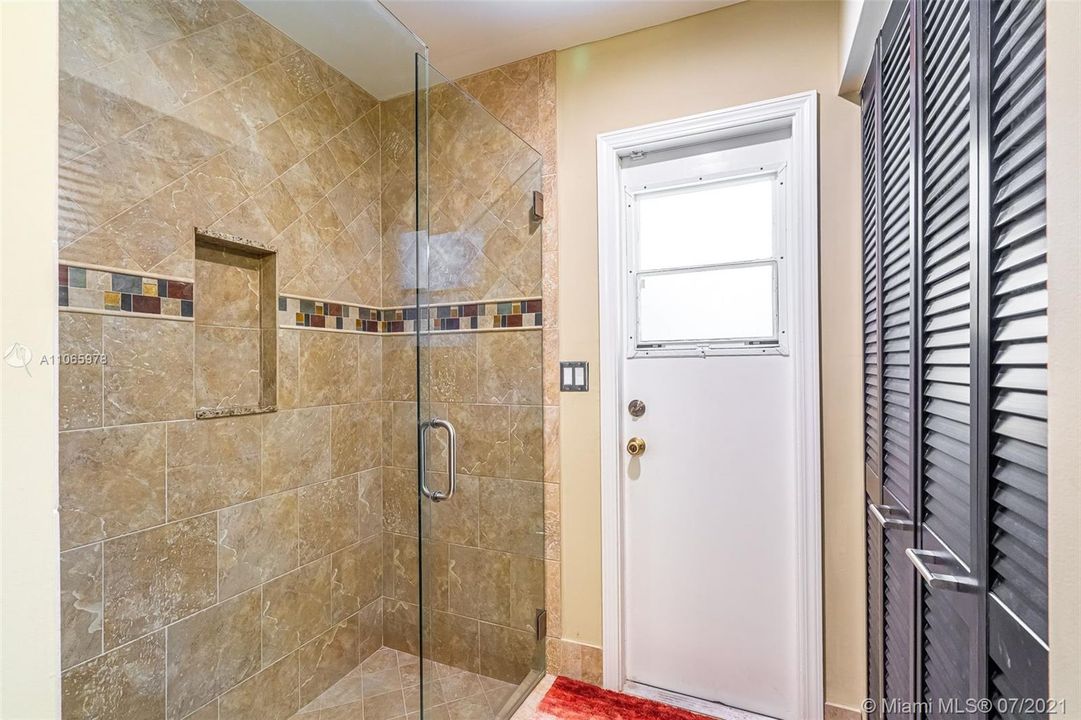 Remodeled bath with great double linen closet & pool access