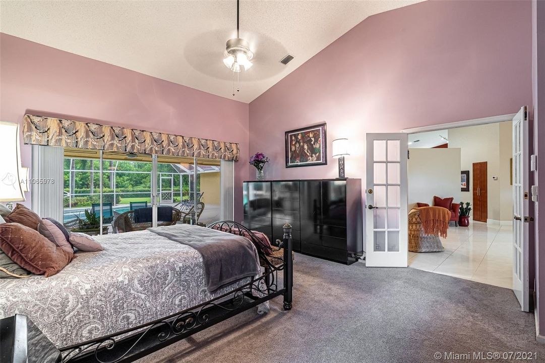 Spacious Master suite with sprawling ceilings & french doors