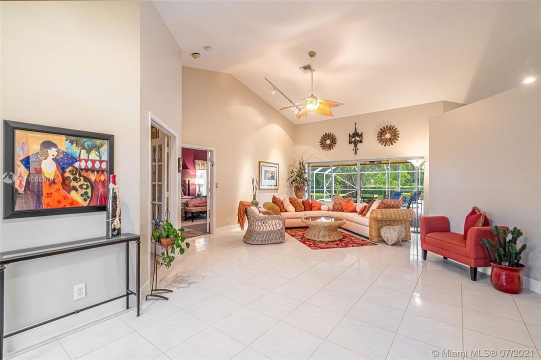 Large open living room overlooking pool patio & yard