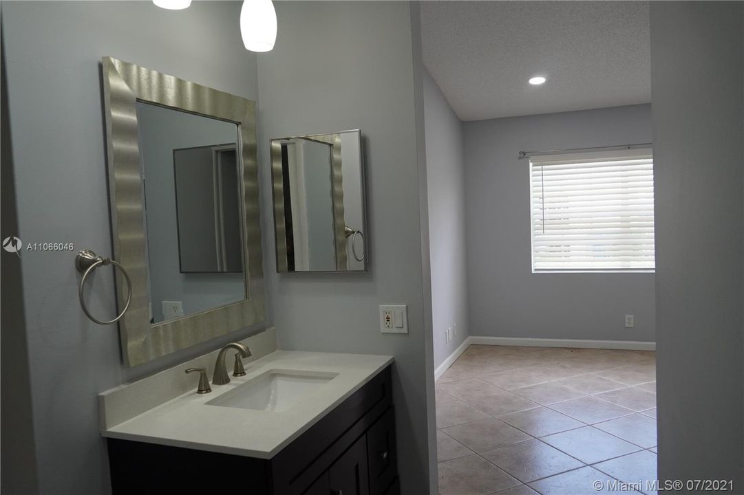 MASTER BATHROOM WITH SEPARATE BATH AREA