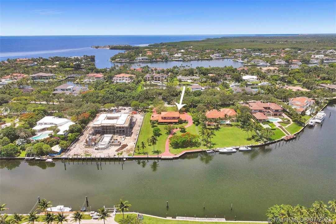 View of the property with Biscayne Bay and Atlantic Ocean beyond. Multi-Million dollar homes grace this community.