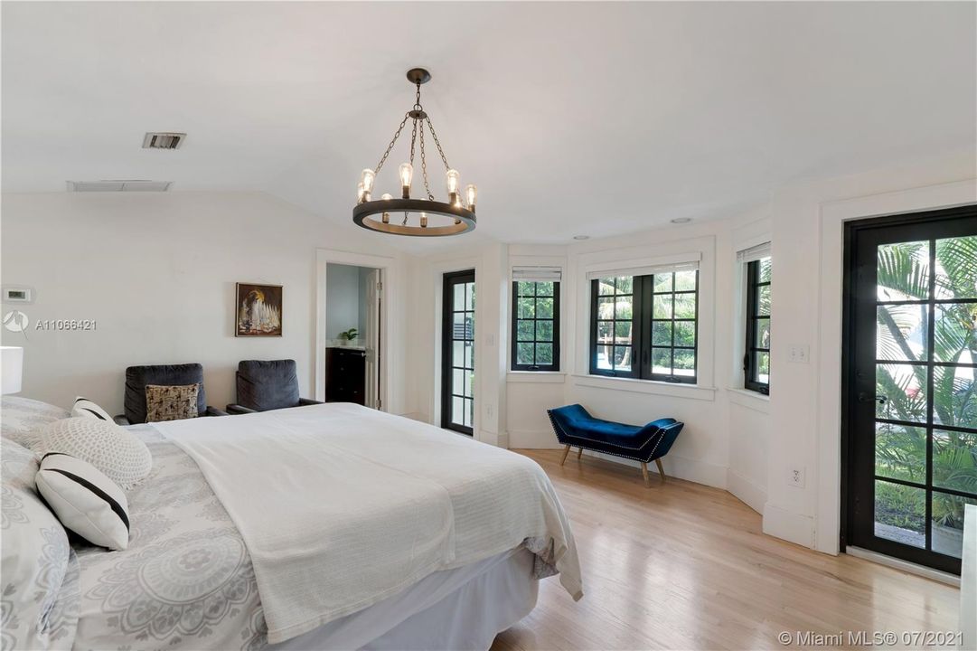 Beautiful views onto the pool from this master bedroom