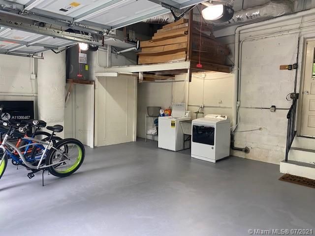 Two car garage with storage & washer/dryer