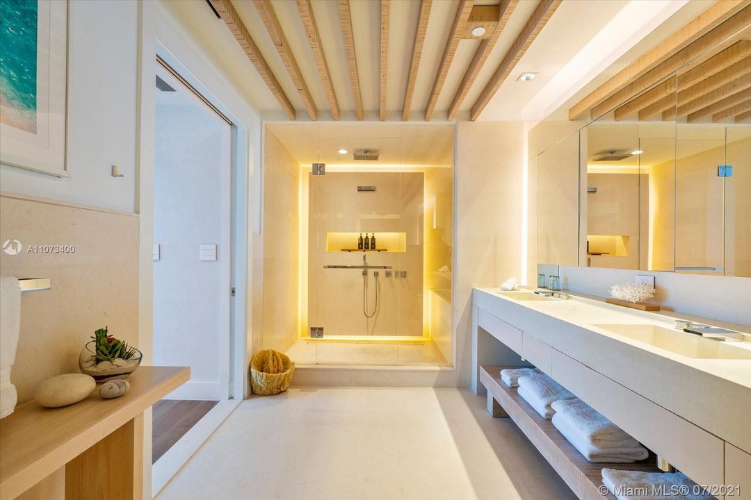 Master bathroom enclosed shower and bathtub combination