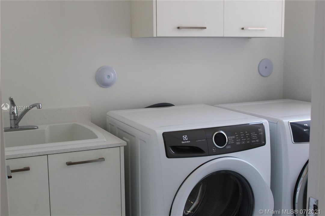 LAUNDRY SINK AND CABINET OVER WASHER/DRYER