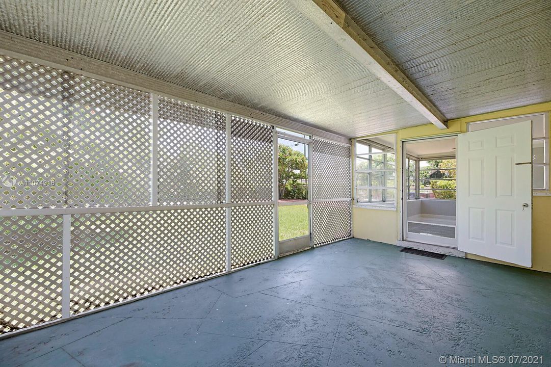 Covered Screen Room leading to fenced yard