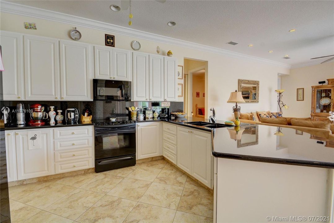 Kitchen opens to Family Room and has views of the lake