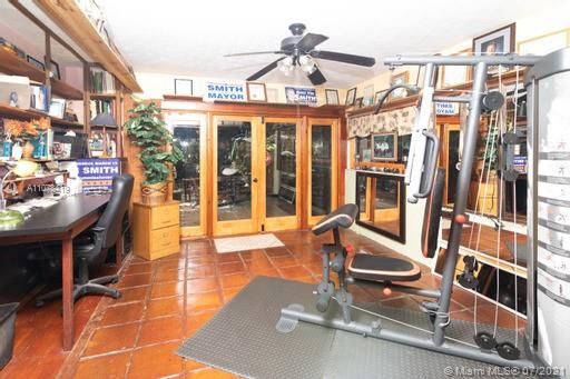 Florida Room Style Home Office, Gym and Den with french doors to The Biggest Deck of All!