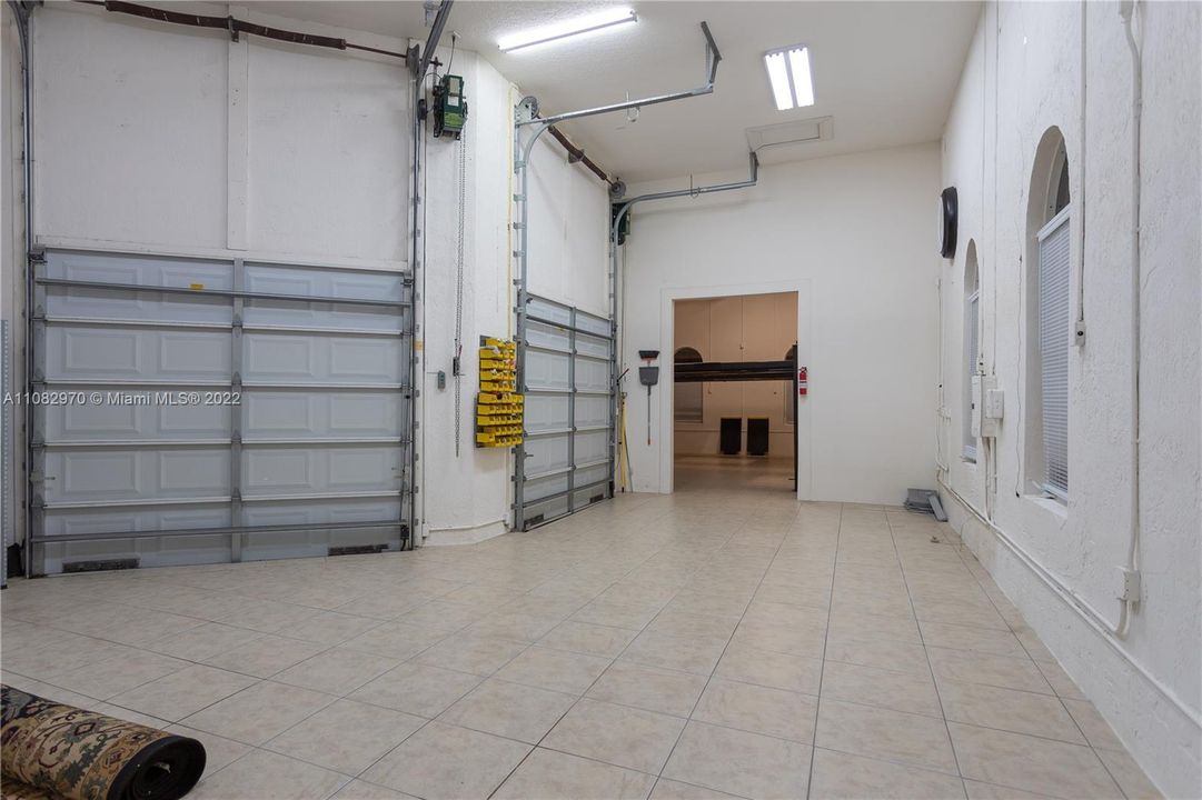 Garage with tall ceiling height to accommodate car lifts