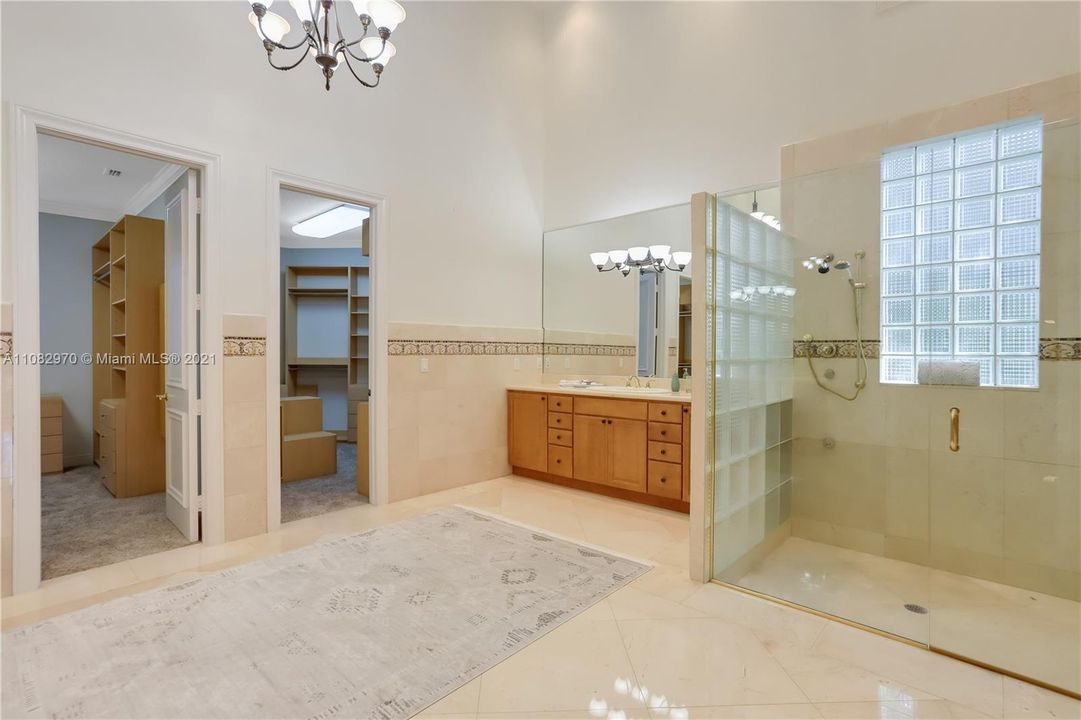 Luxurious master bathroom with his and her areas 2  large built in closets