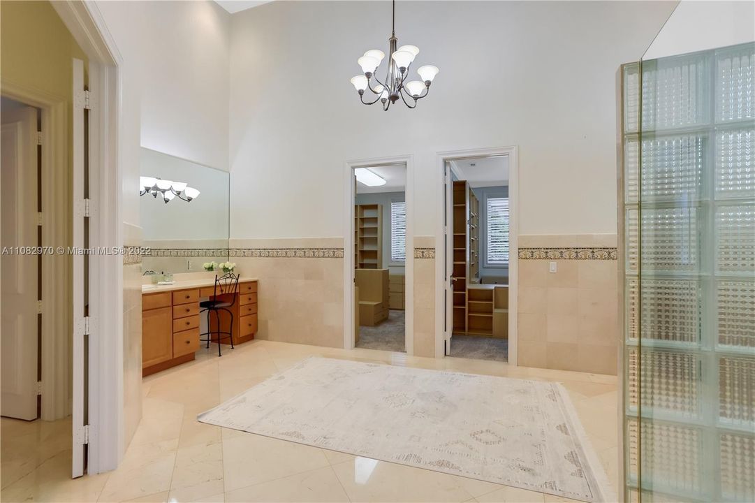 Luxurious master bathroom with his and hers areas and 2  large built in closets