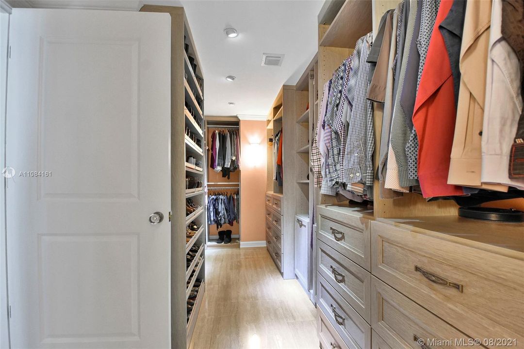 Huge master bedroom walk- in closet from California's Closets.