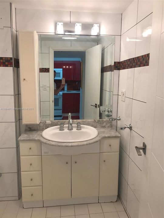 custom mirror with cabinets