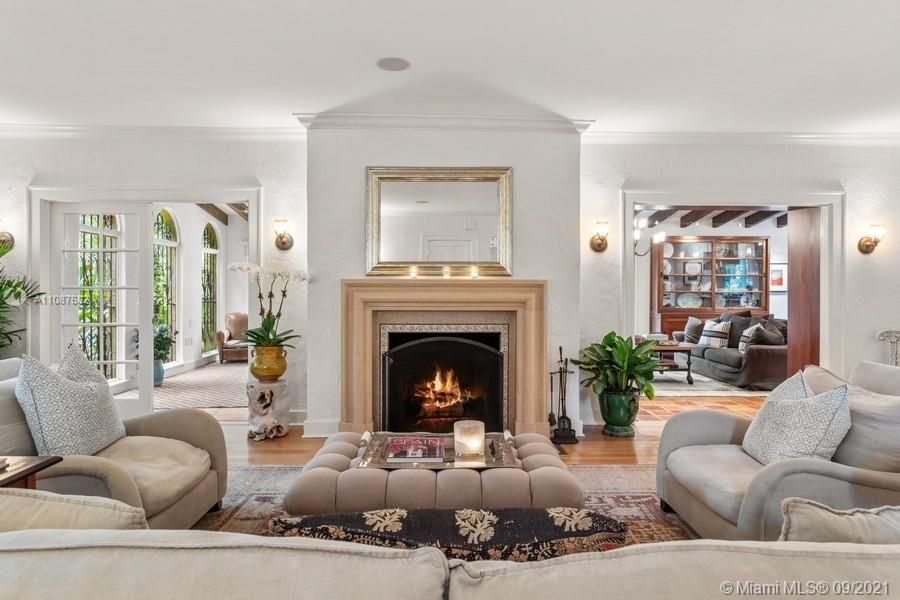 The ample size formal and informal areas include a captivating fireplace and perfectly finished wood ceilings.