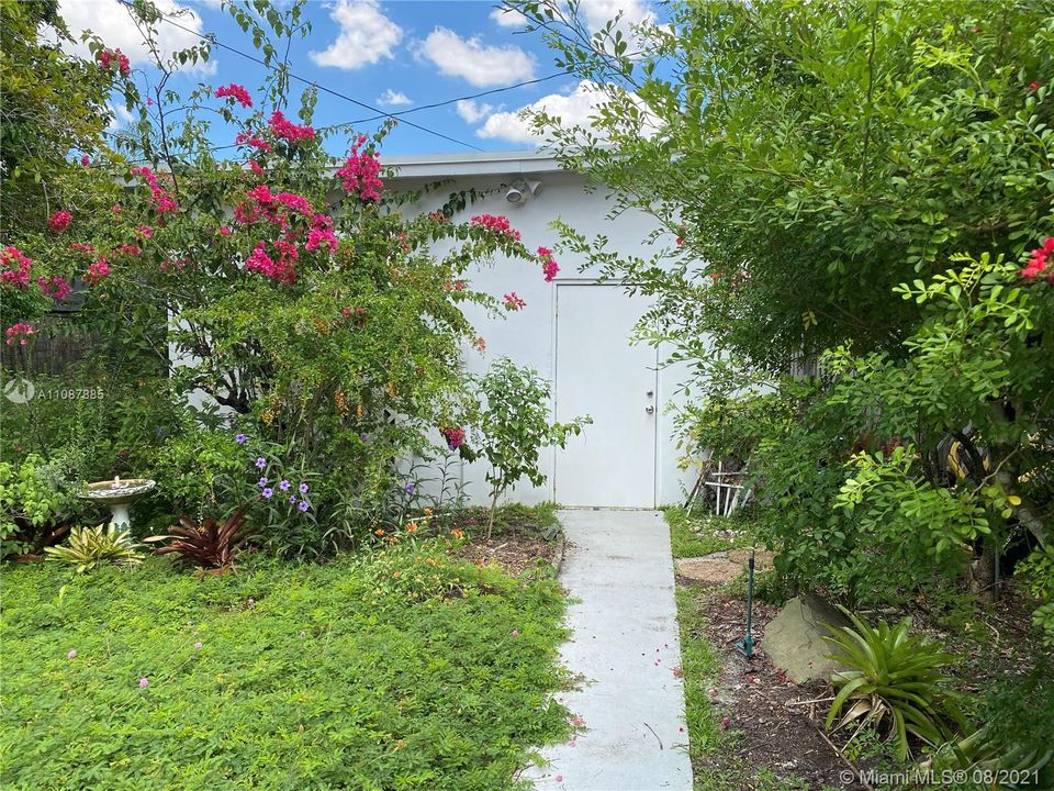 Detached garage entrance from backyard.