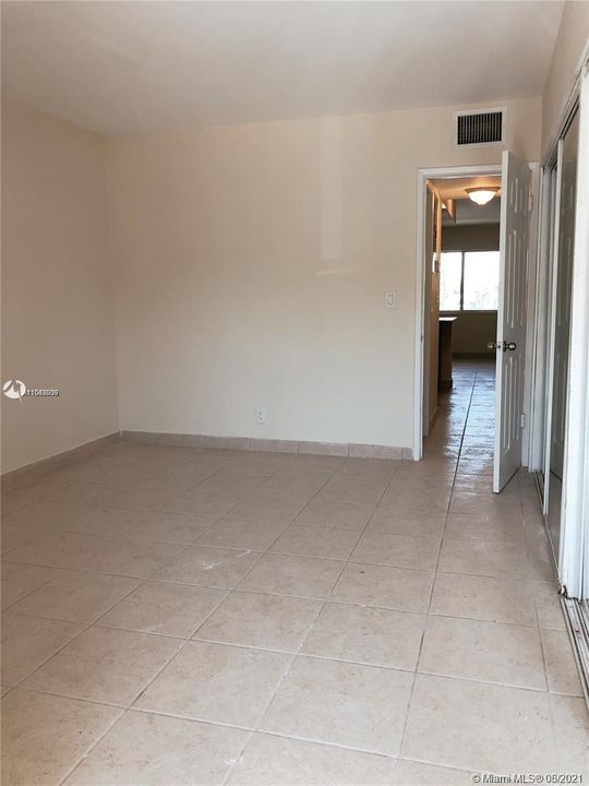 View from back entrance (door into bedroom) looking toward window in main living area.