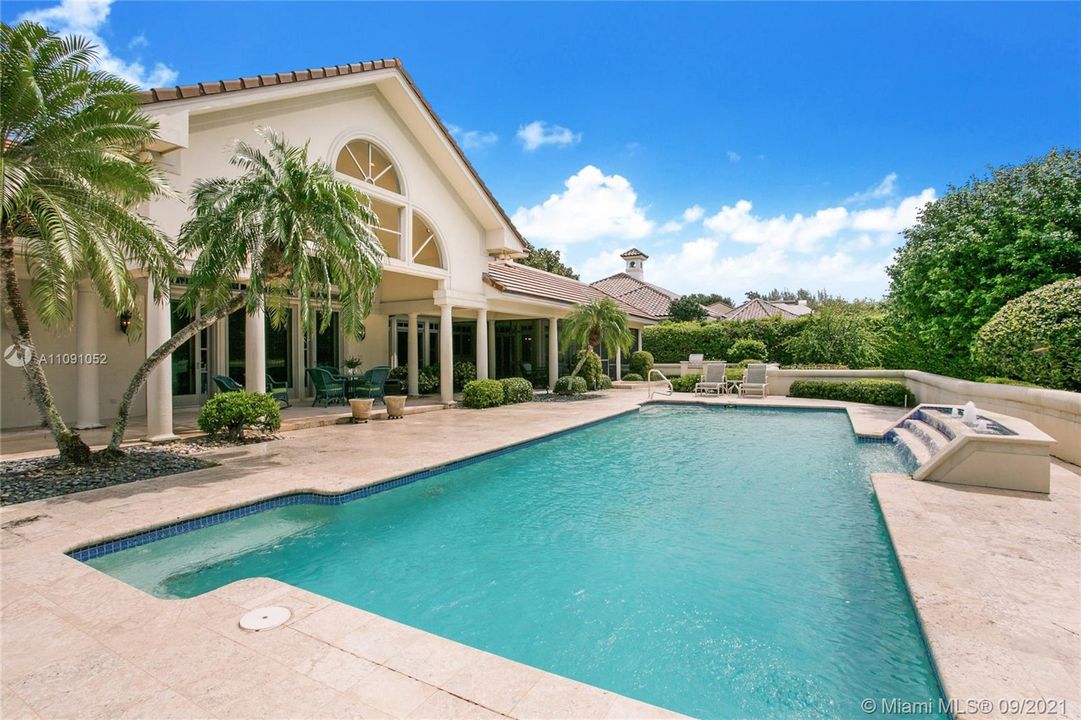 Pool and view of back of home