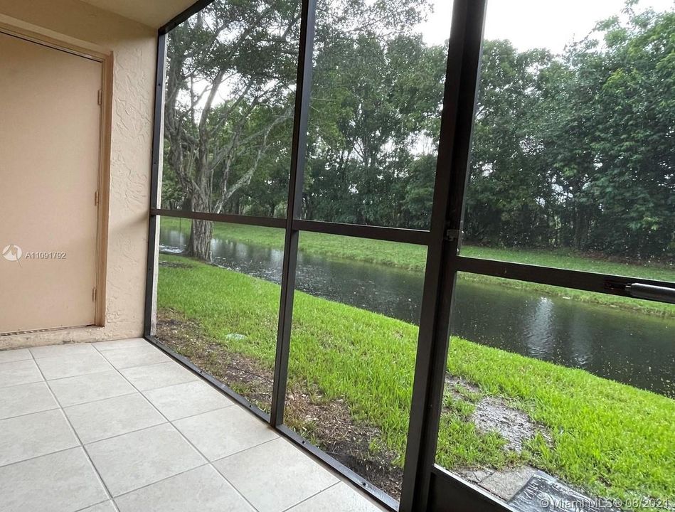 Covered patio with storage,overlooking the canal.