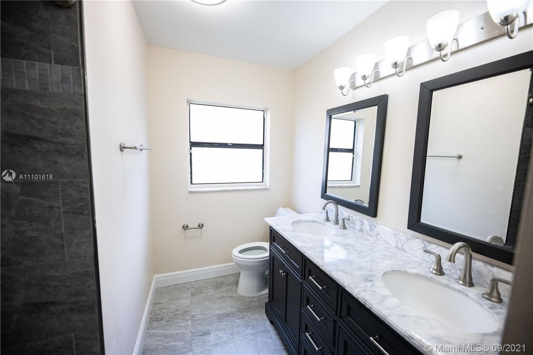 SECOND BATHRROM W/ DOUBLE SINK VANITY AND TUB/SHOWER