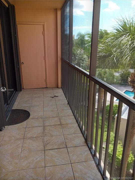 Screened In Balcony with Storage Area & View of the Pool