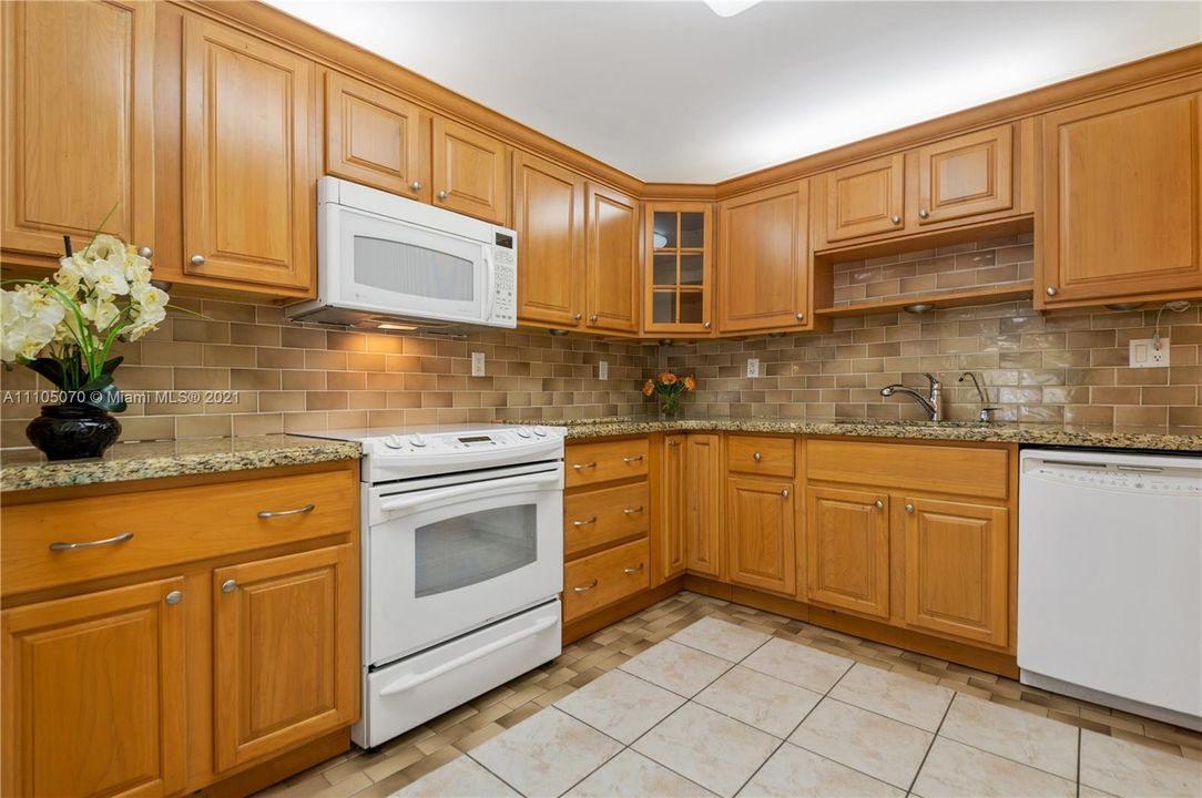 Kitchen with Maple cabinets and granite tops