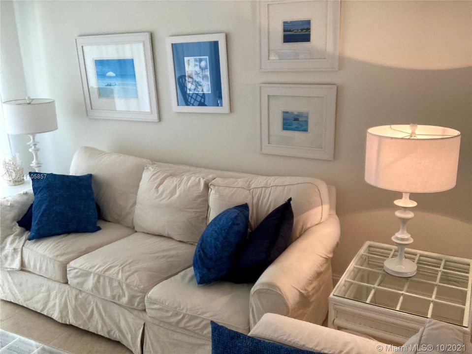 Living room with adjoining screened porch.