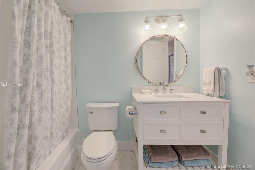RENOVATED BATHROOM WITH A TUB