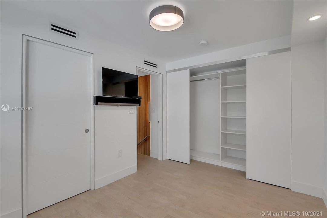Ample storage available and wall mounted tv maximize space in this room