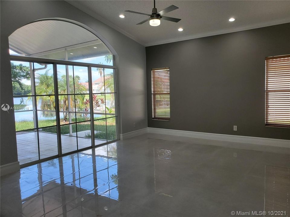 Family Room with high volume ceilings and lake view