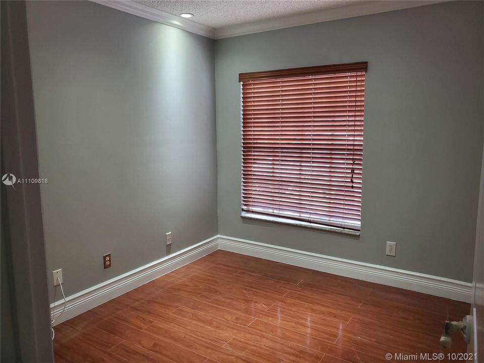 Second bedroom with designer laminate floors