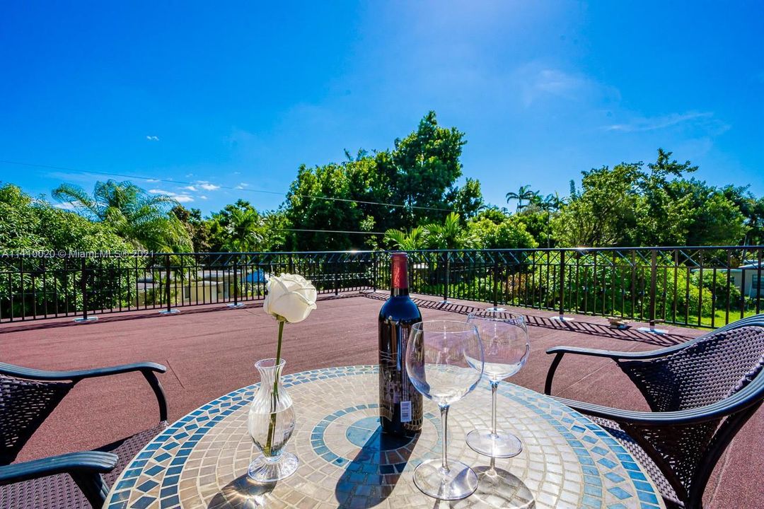 Railed terrace provides an excellent place to enjoy our wonderful Florida weather.