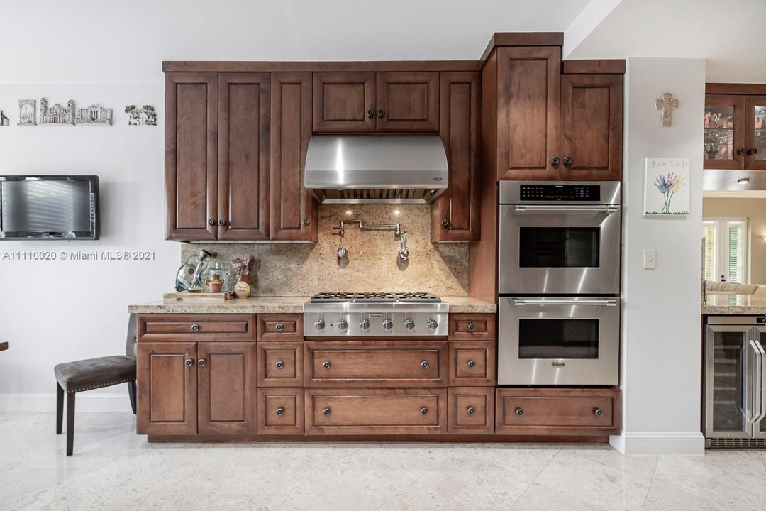 Double wall oven and six burner gas stove.