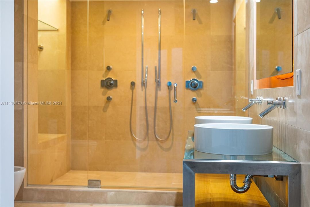 The master bath is equipped with a two person Shower