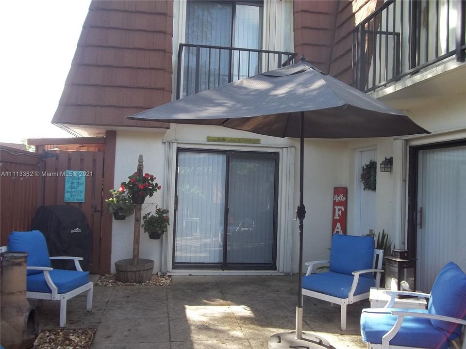 Courtyard with storage closet & accordion shutters