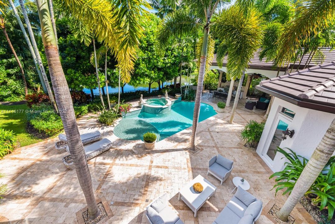 Tons of Gorgeous Space to Entertain and Relax overlooking the beautiful Lake Surrounded by Tropical Lush Landscaping and a sparkling pool.  The HUGE covered Lanai is right out of the pages of a magazine